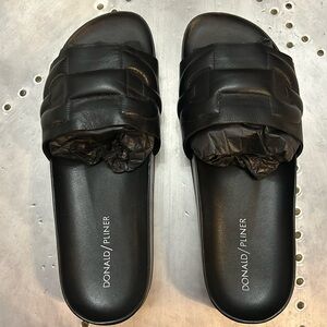 Donald Pliner BUOY black slides. Women’s size 9. Gently used with box